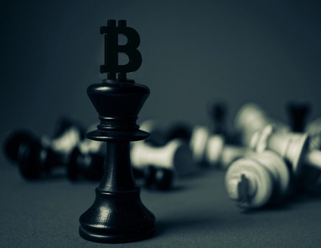 Chess piece with bitcoin logo on top